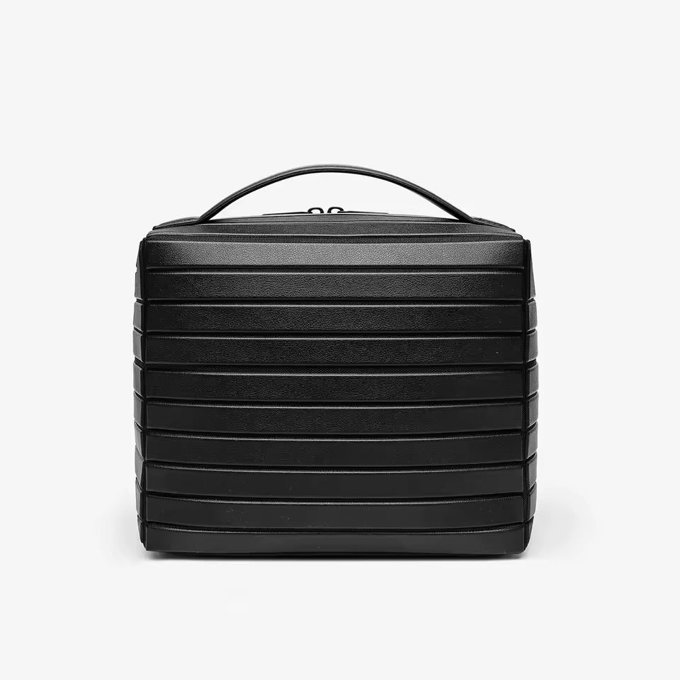 The Compackt Traveller — close-up of interior no-spill compartments with travel products