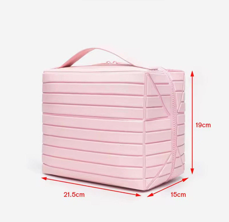 The Compackt Traveller — side profile showing slim fold-down bag dimensions
