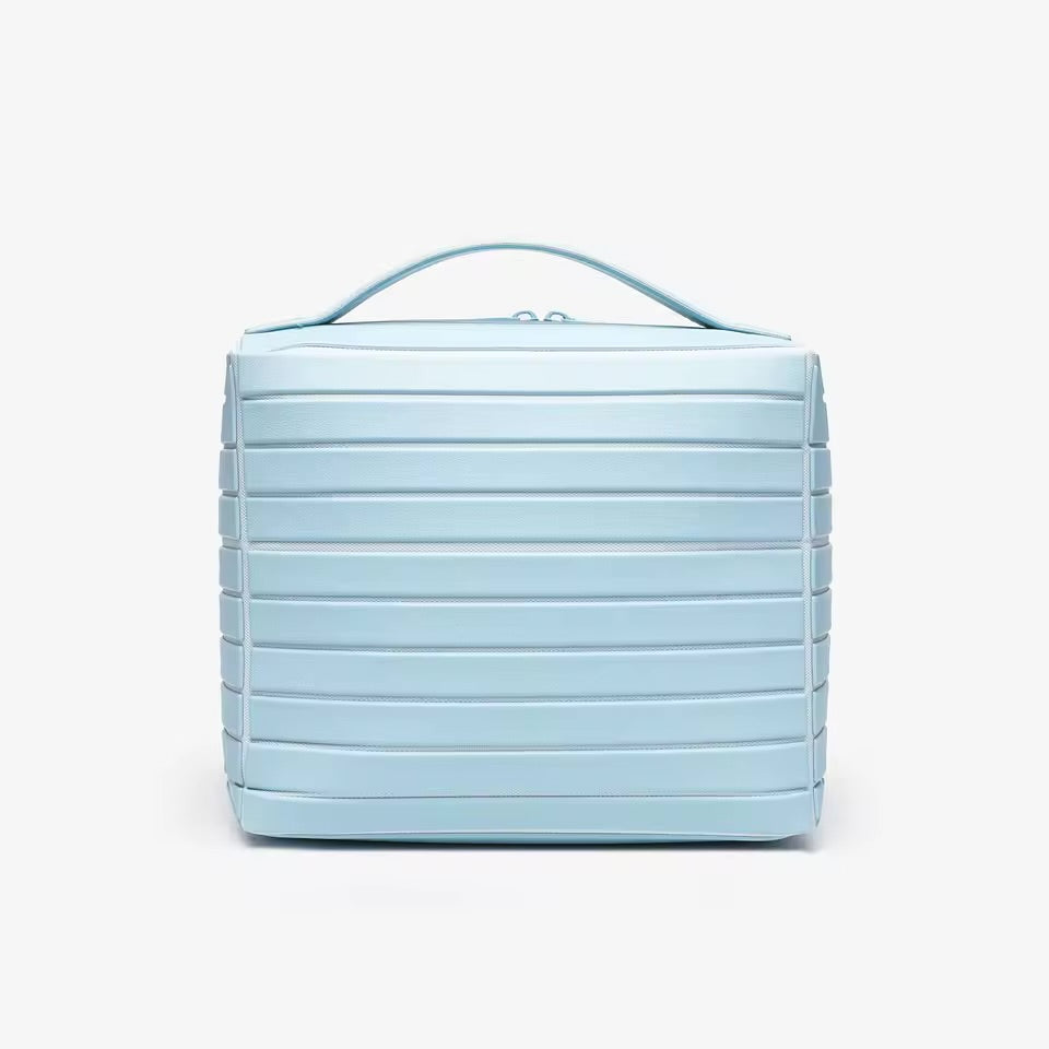 The Compackt Traveller — lifestyle shot in hotel bathroom showing practical travel organisation