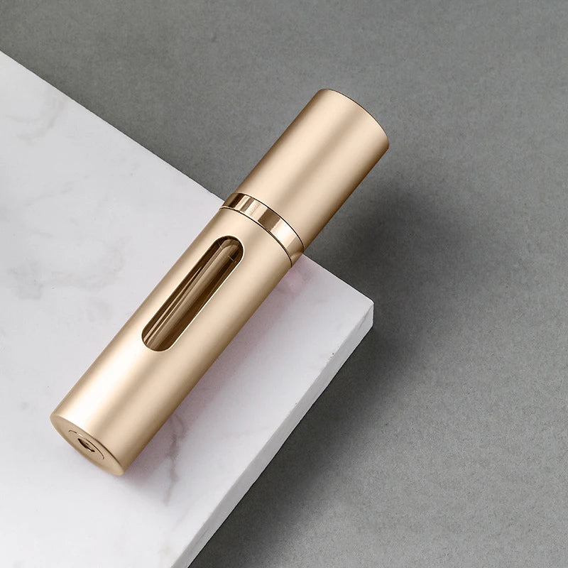 The Packt Atomizer — size comparison showing 5ml bottle fits in the palm of a hand