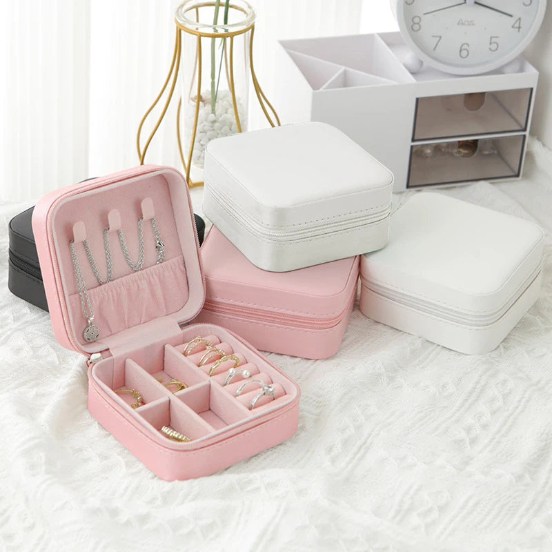 The Packt Jewels travel jewelry organizer — lifestyle shot showing rings earrings and necklaces organized inside