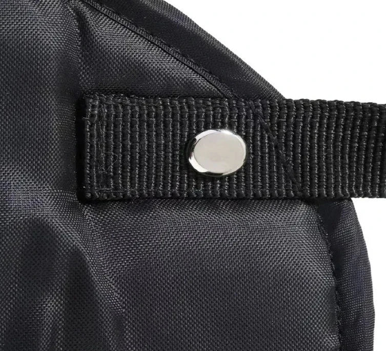 The Packt Hammock clipped to airplane tray table — in-use side view
