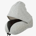 The Packt Pillow — compressed and clipped to carry-on luggage handle
