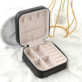 The Packt Jewels travel jewelry organizer in Pink — front view showing hard-shell clamshell design
