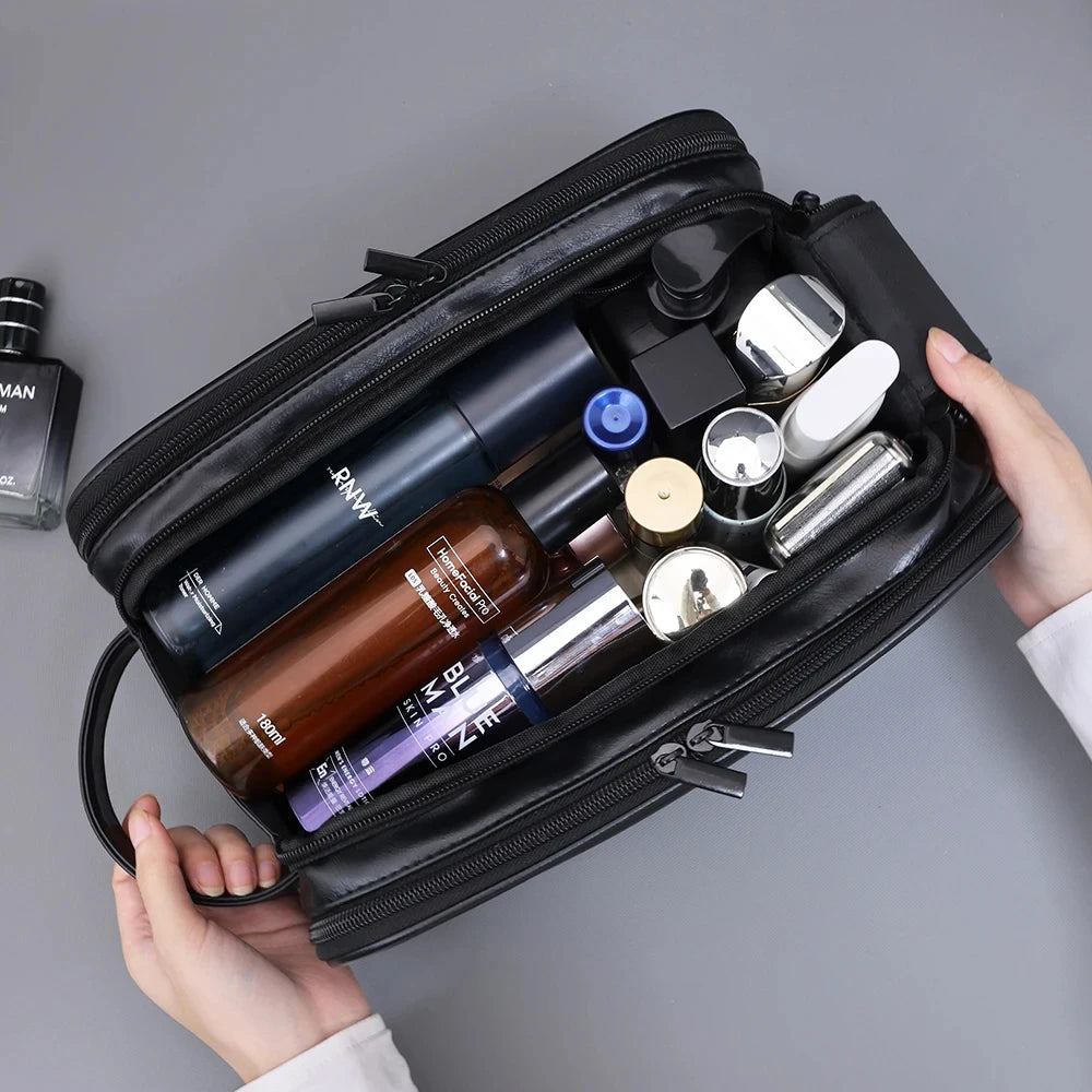 The Packt Kit open on a counter — main compartment plus two fold-out organizer panels