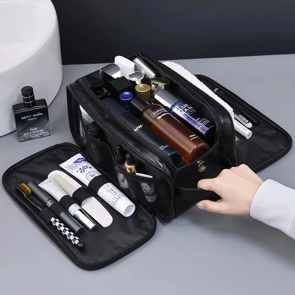 The Packt Kit travel toiletry bag open — fold-down mesh organizer panel with razor, comb, and toothbrush visible