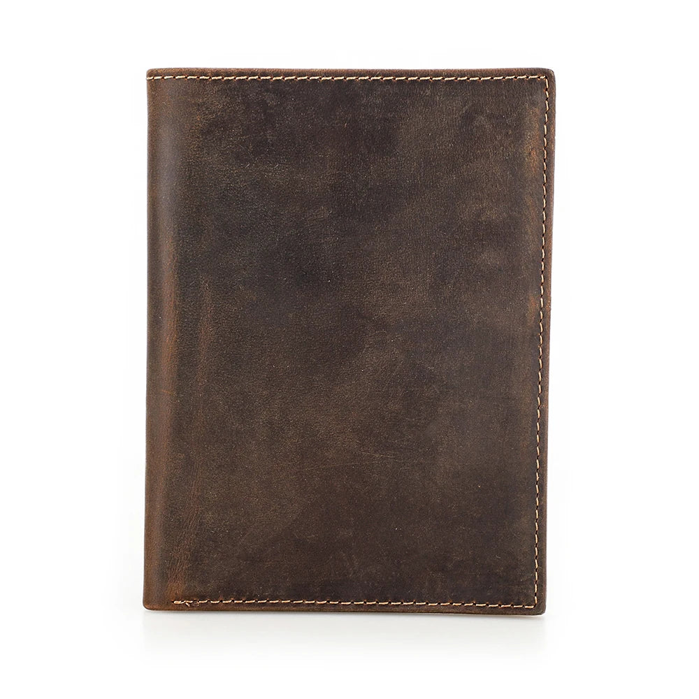 The Packt Passport being held in hand — compact slim profile passport organizer