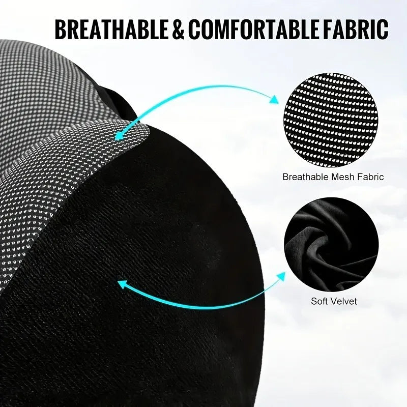 The Packt Pillow in Grey — hood up providing light-blocking privacy during travel