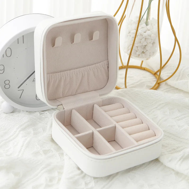 The Packt Jewels travel jewelry organizer — close-up of hard-shell exterior and clasp mechanism