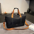 The Packt Weekender travel duffel bag in Black — 20–35L weekender with shoe compartment