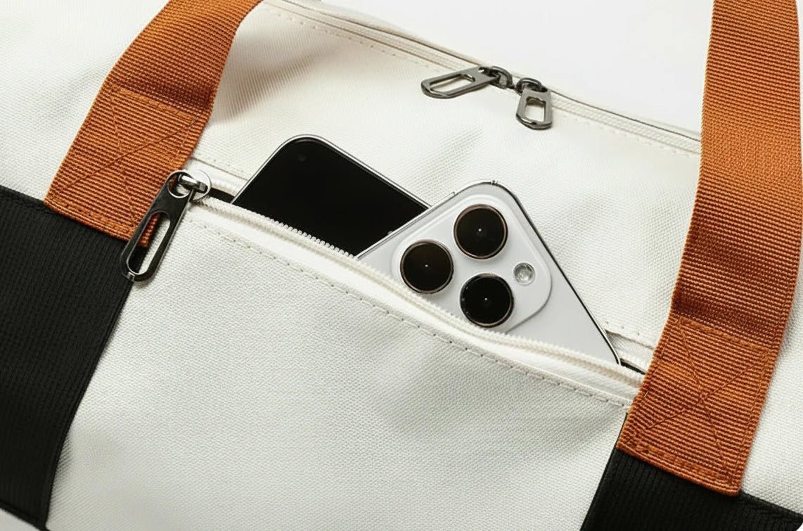 The Packt Weekender front zip pocket — quick access for phone, wallet, and boarding pass