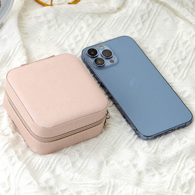 The Packt Jewels travel jewelry organizer — top-down view showing all compartments organized with jewelry