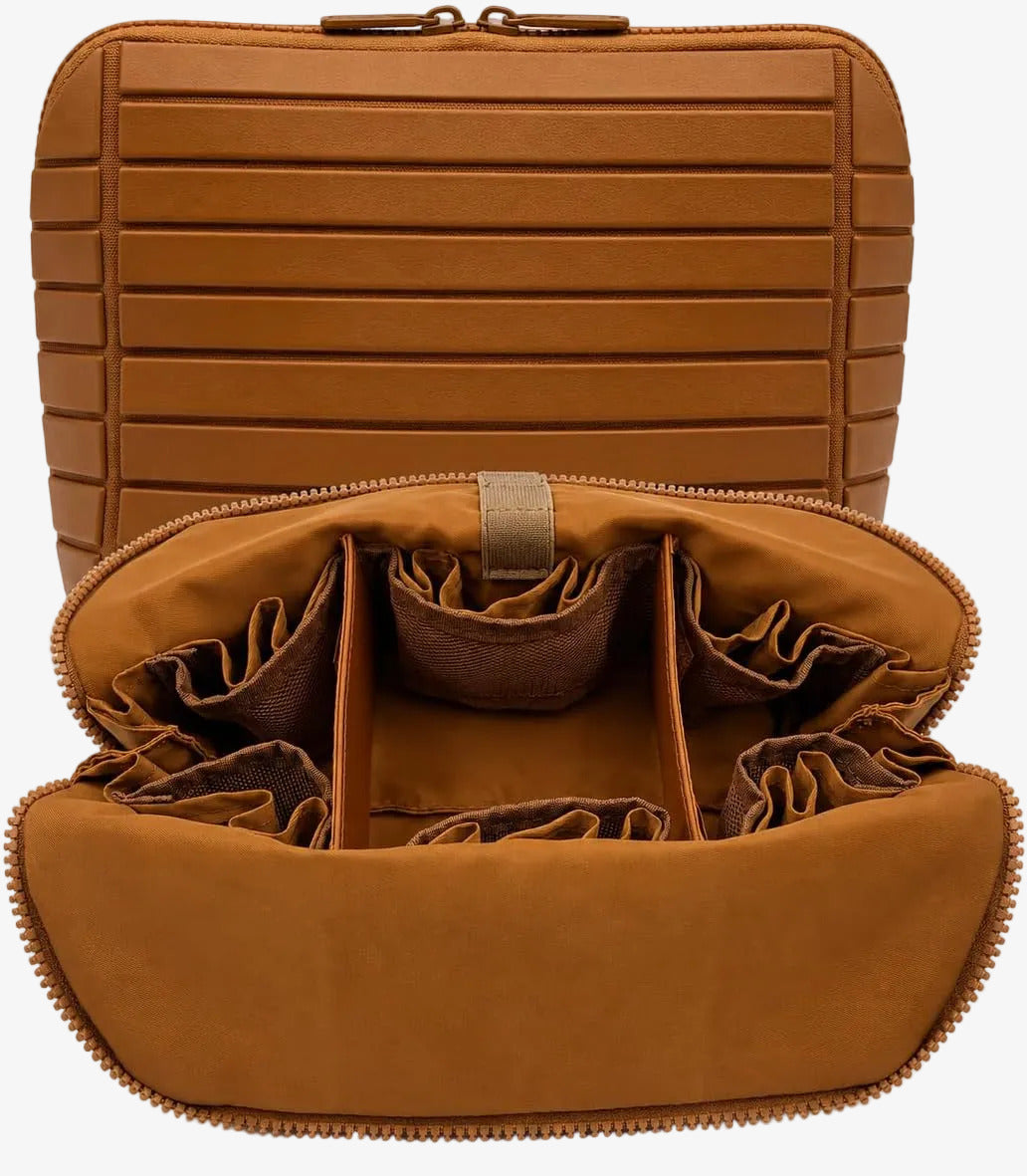The Packt Traveller toiletry bag in Brown — open view showing 27 pockets and adjustable dividers