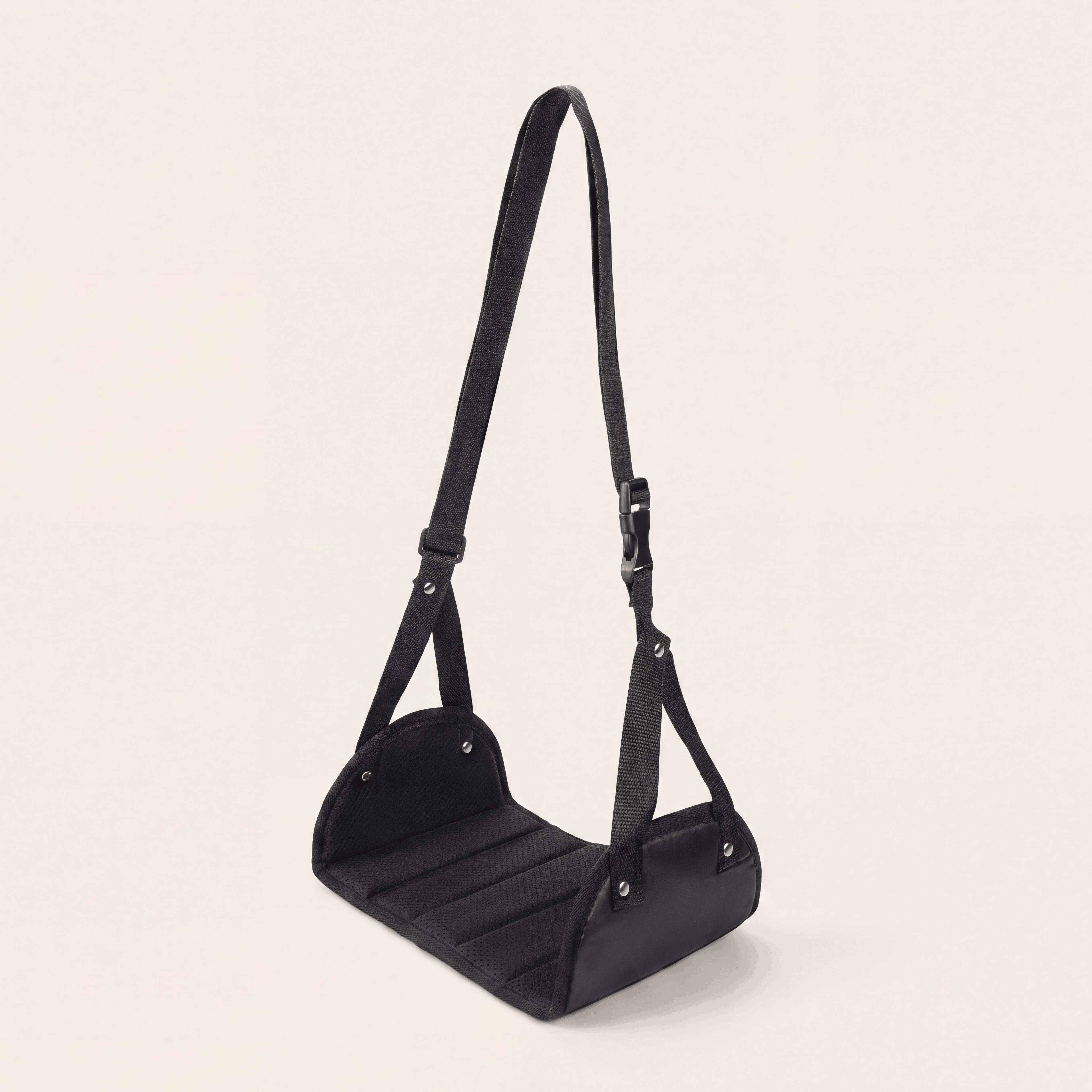 The Packt Hammock — portable airplane footrest that clips to the tray table