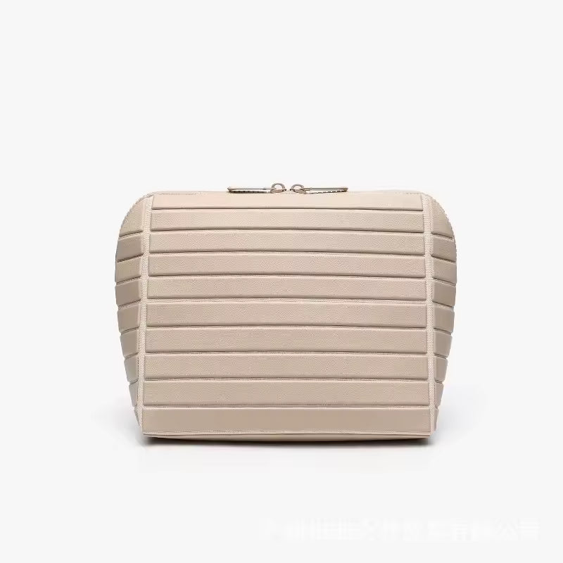 The Packt Traveller toiletry bag in Khaki — front view showing ribbed exterior and double zipper