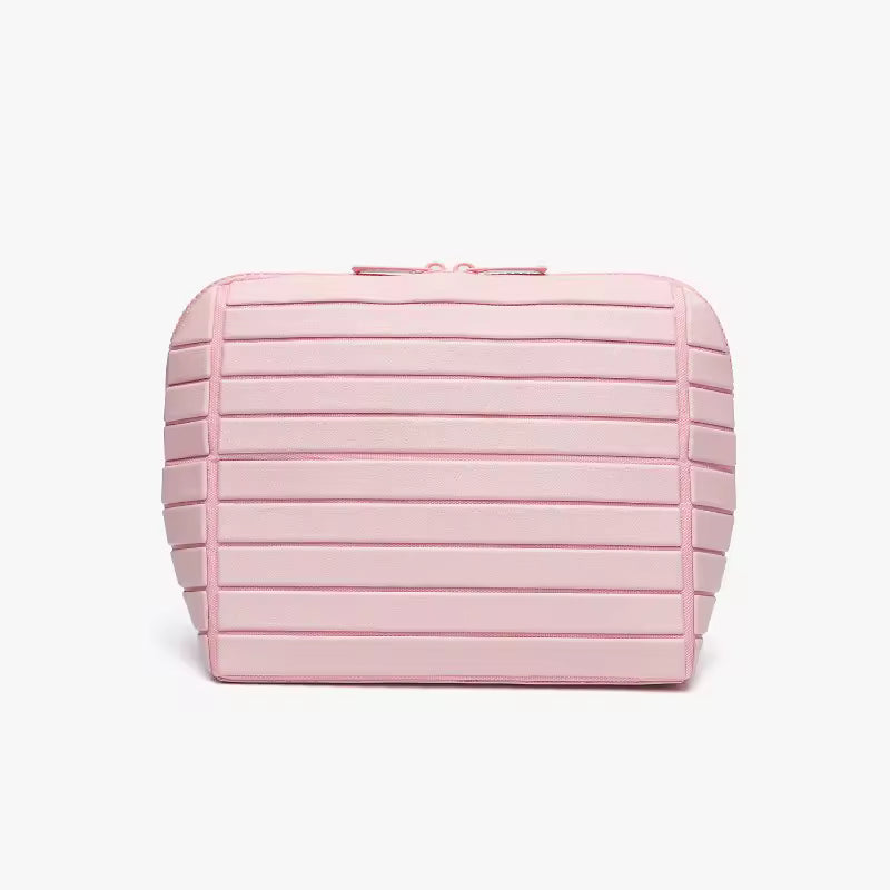 The Packt Traveller toiletry bag in Pink — front view showing ribbed exterior and double zipper