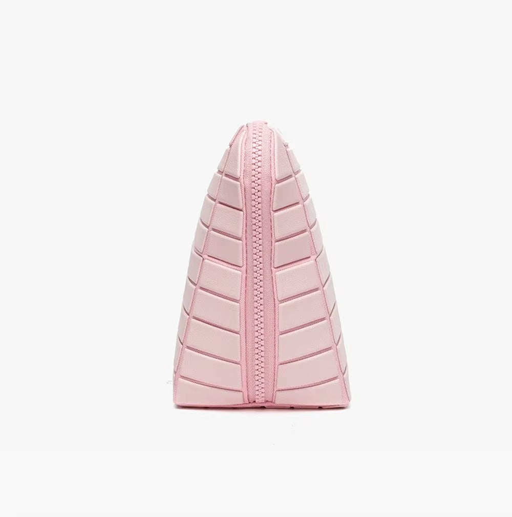 The Packt Traveller toiletry bag — side profile showing wedge shape and zipper closure