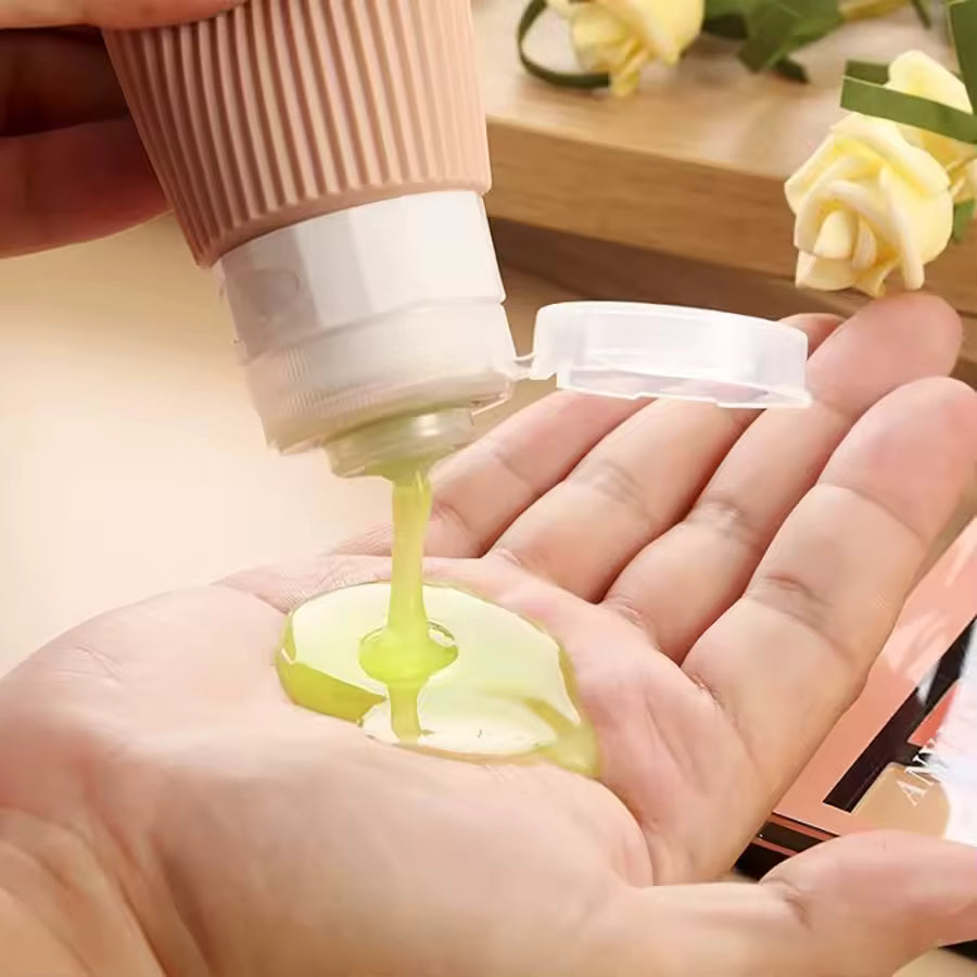 The Packt Refills — squeezable silicone bottle dispensing lotion with no-drip valve
