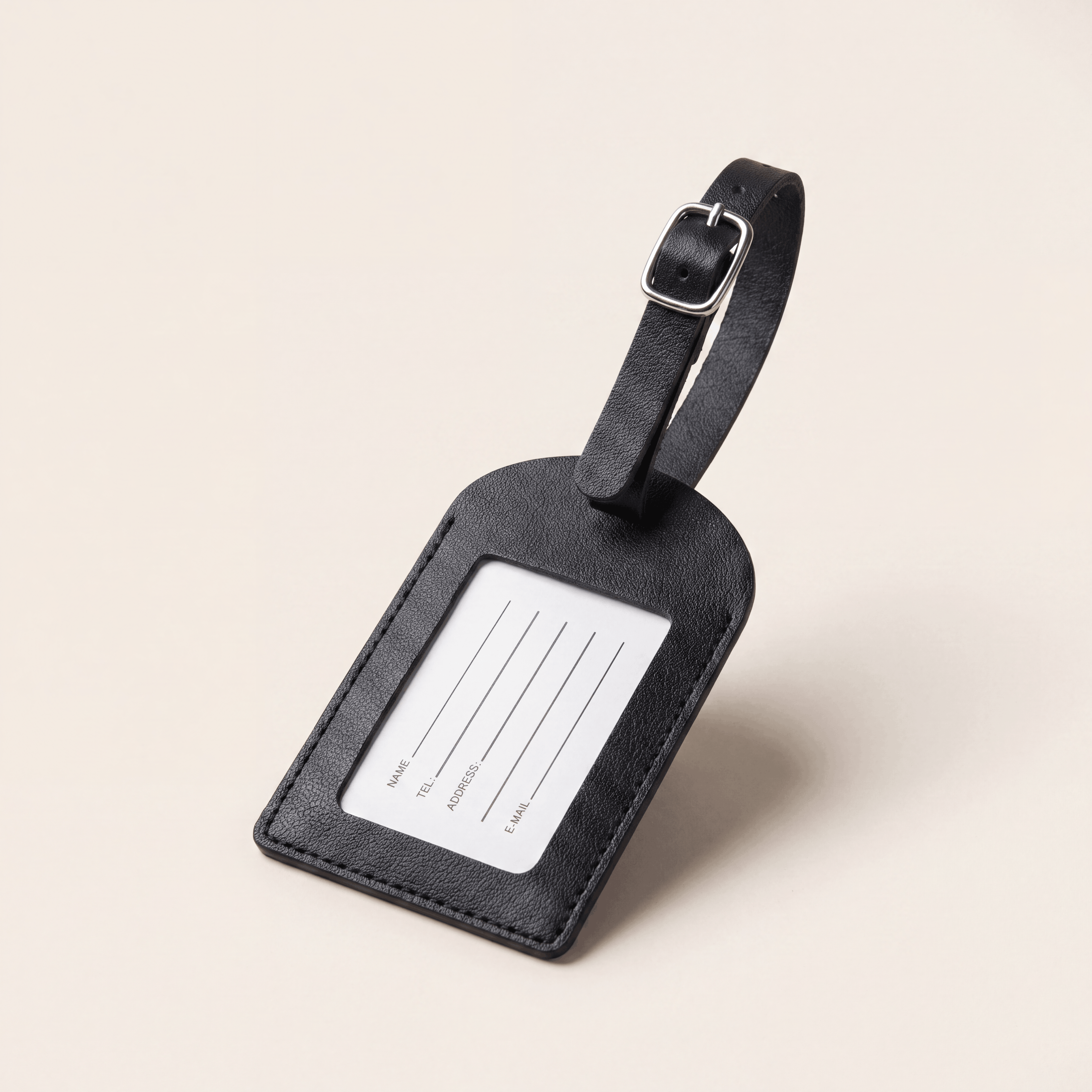 The Packt Tag — PU leather luggage tag with clear ID window